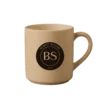A caramel mug with Burnt Sugar's round logo.