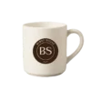 A cream mug with Burnt Sugar's round logo.
