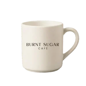 A cream mug with Burnt Sugar's text logo.