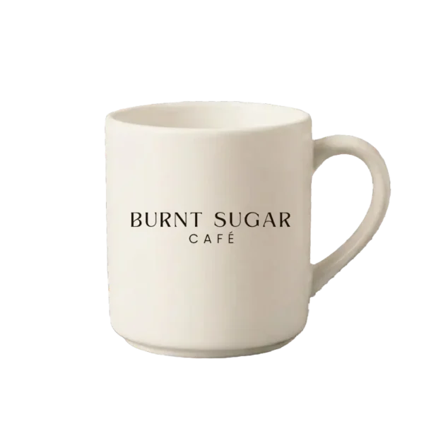 A cream mug with Burnt Sugar's text logo.