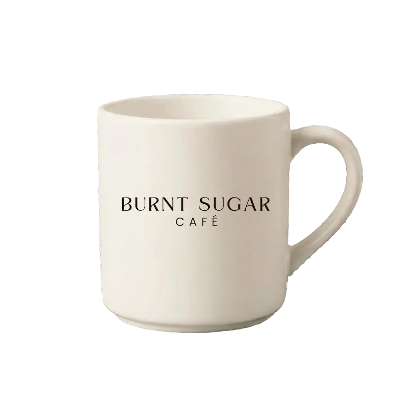 A cream mug with Burnt Sugar's text logo.