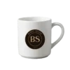 A white mug with Burnt Sugar's round logo.