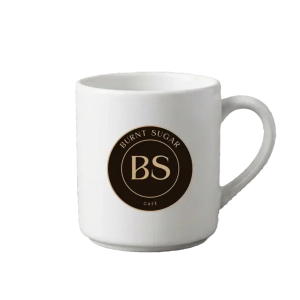 A white mug with Burnt Sugar's round logo.